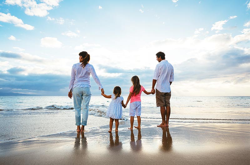 Parents with Childs walking at the beach | Creative Systems