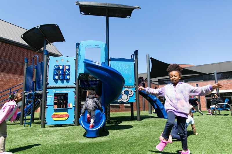 kids playing with playground equipment