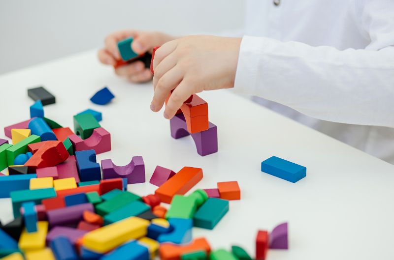 kid playing with blocks